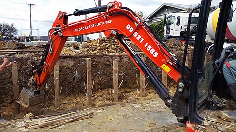 Earthmoving contractors in Auckland constructing a new retaining wall